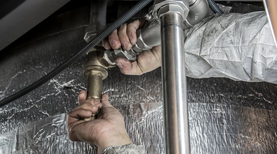 Tankless water heater installation in a home utility space