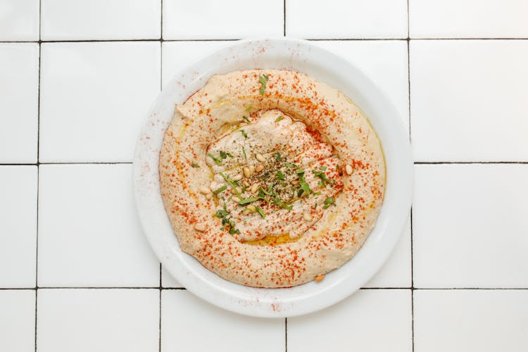 Close-Up Shot Of A Hummus On A Plate