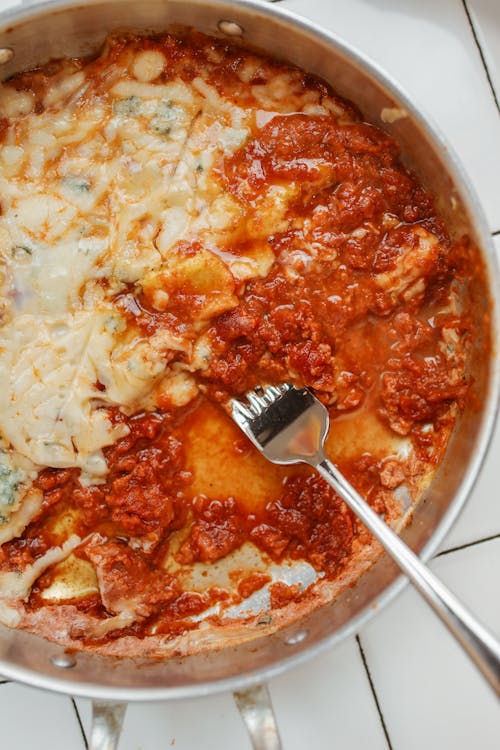 Sauce With Tomato and Cheese in an Aluminum Pan