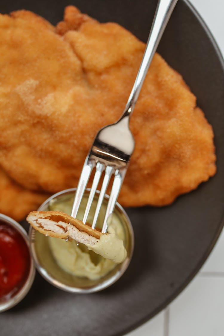 A Meal Of Deep Fried Chicken With Dips