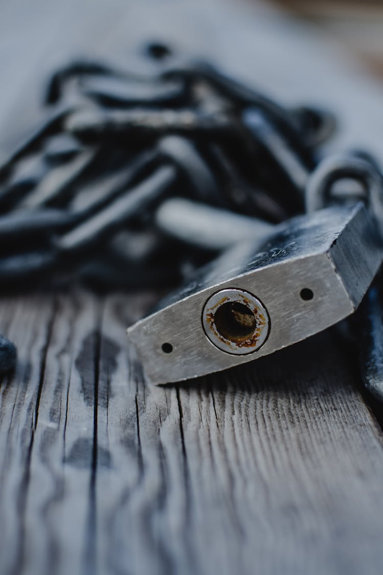 A Wood With A Chain And A Padlock 