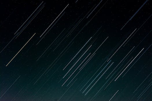 Long exposure photo capturing stunning star trails against a dark night sky.