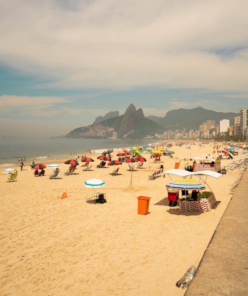 Free People on the Beach at Summertime Stock Photo