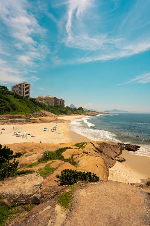 People on Beach Under Blue Sky