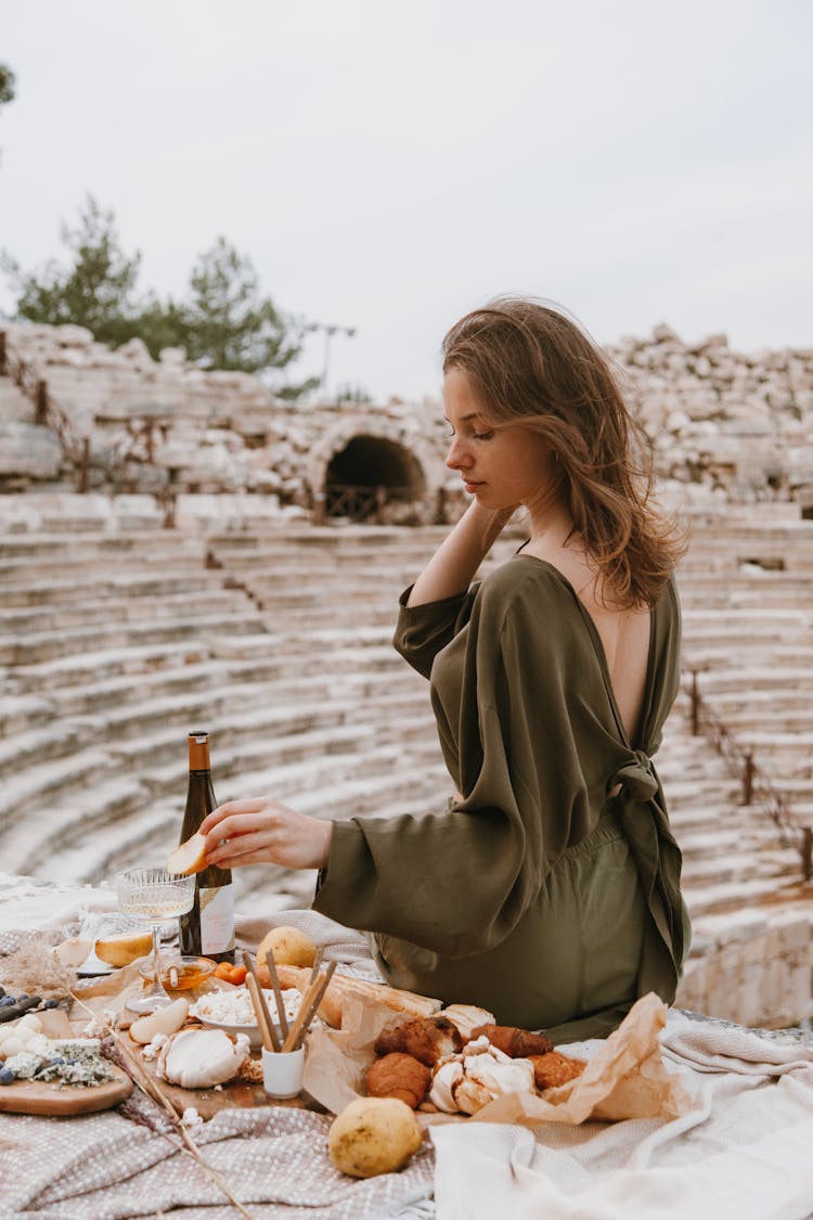 A Woman Picnic Date In A Coliseum Ruins