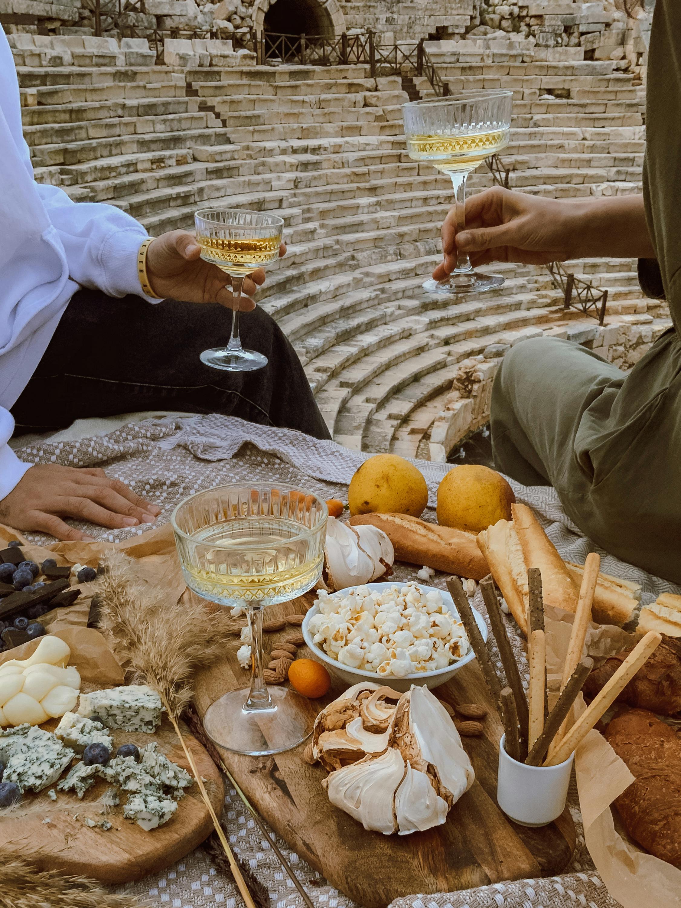 Free A romantic picnic at an ancient theater with wine and gourmet snacks in Kaş, Turkey. Stock Photo