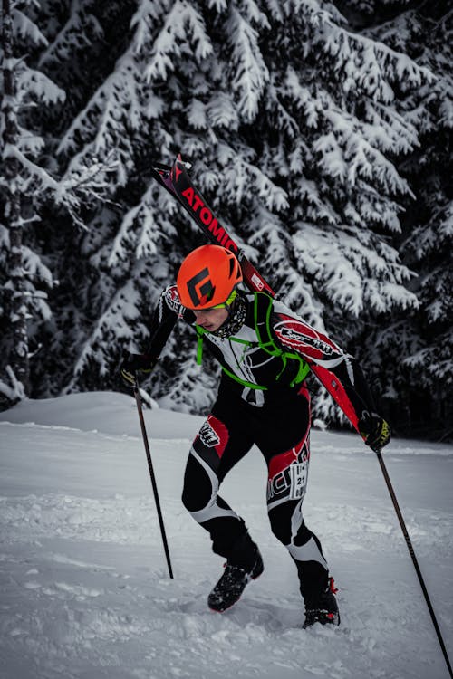 Free Man Walking On Snow With His Skis Stock Photo
