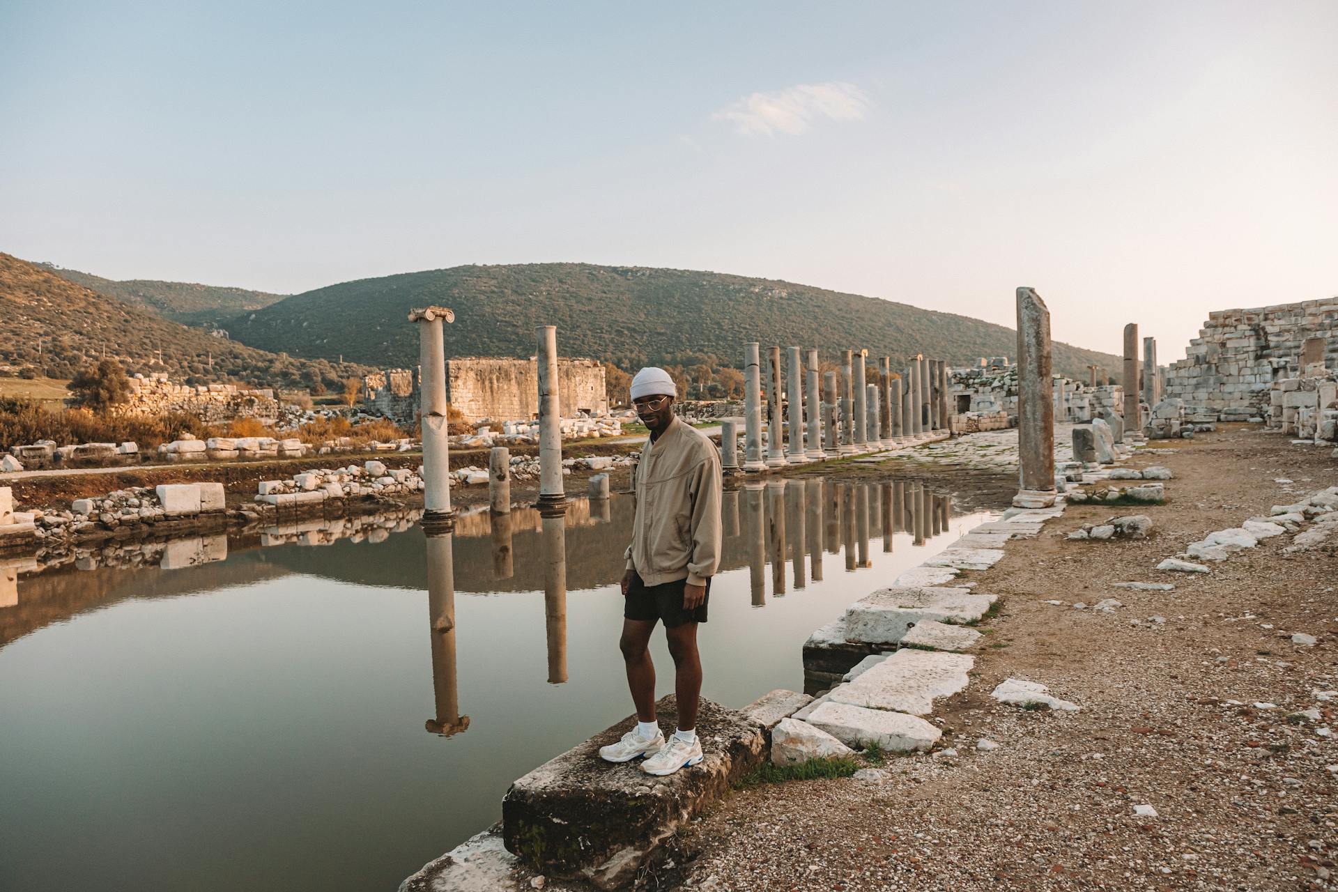 A Man Standing on a Concrete Dock