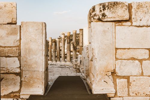Free Explore ancient architecture with stone columns and ruins under a clear sky. Stock Photo