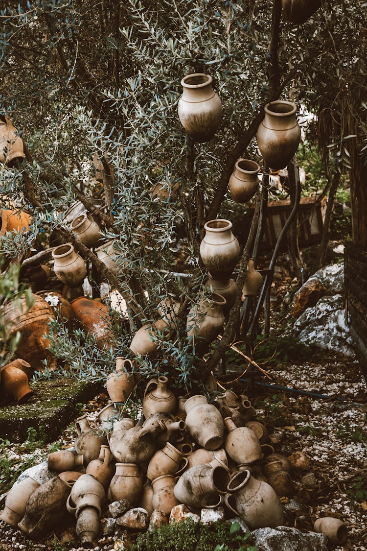 A Pile Of Clay Pots On The Ground