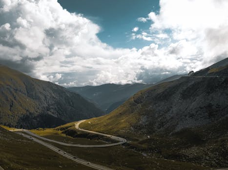 Breathtaking aerial view of the Transfagarasan Highway in Romania's Carpathian Mountains. Ideal for travel enthusiasts.