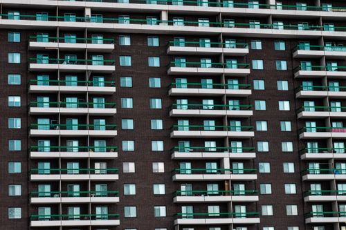 Free Close-up view of a modern apartment building facade with balconies in Montreal, Canada. Stock Photo
