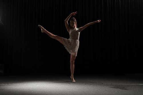 Free A Ballerina Dancing in the Dark Stock Photo