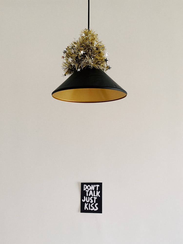 A Pendant Light And A Wall Decor