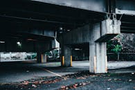 Columns of concrete bridge on city street