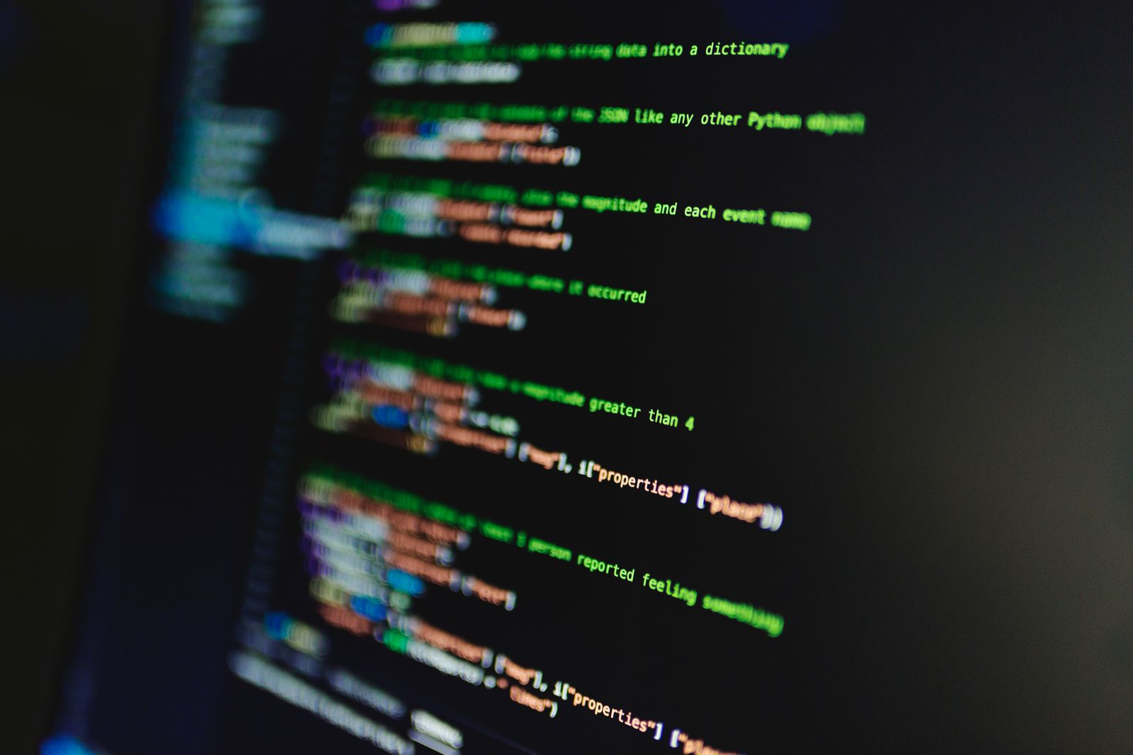 Colorful lines of code on a dark screen representing a signed manifest
