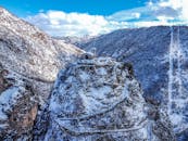 Small castle on snowy hilltop in winter highlands