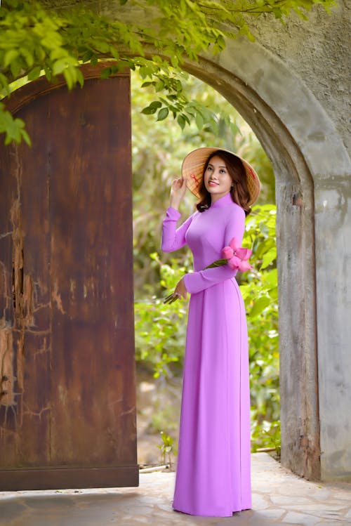 Free A Beautiful Woman in an Ao Dai and Non La Stock Photo