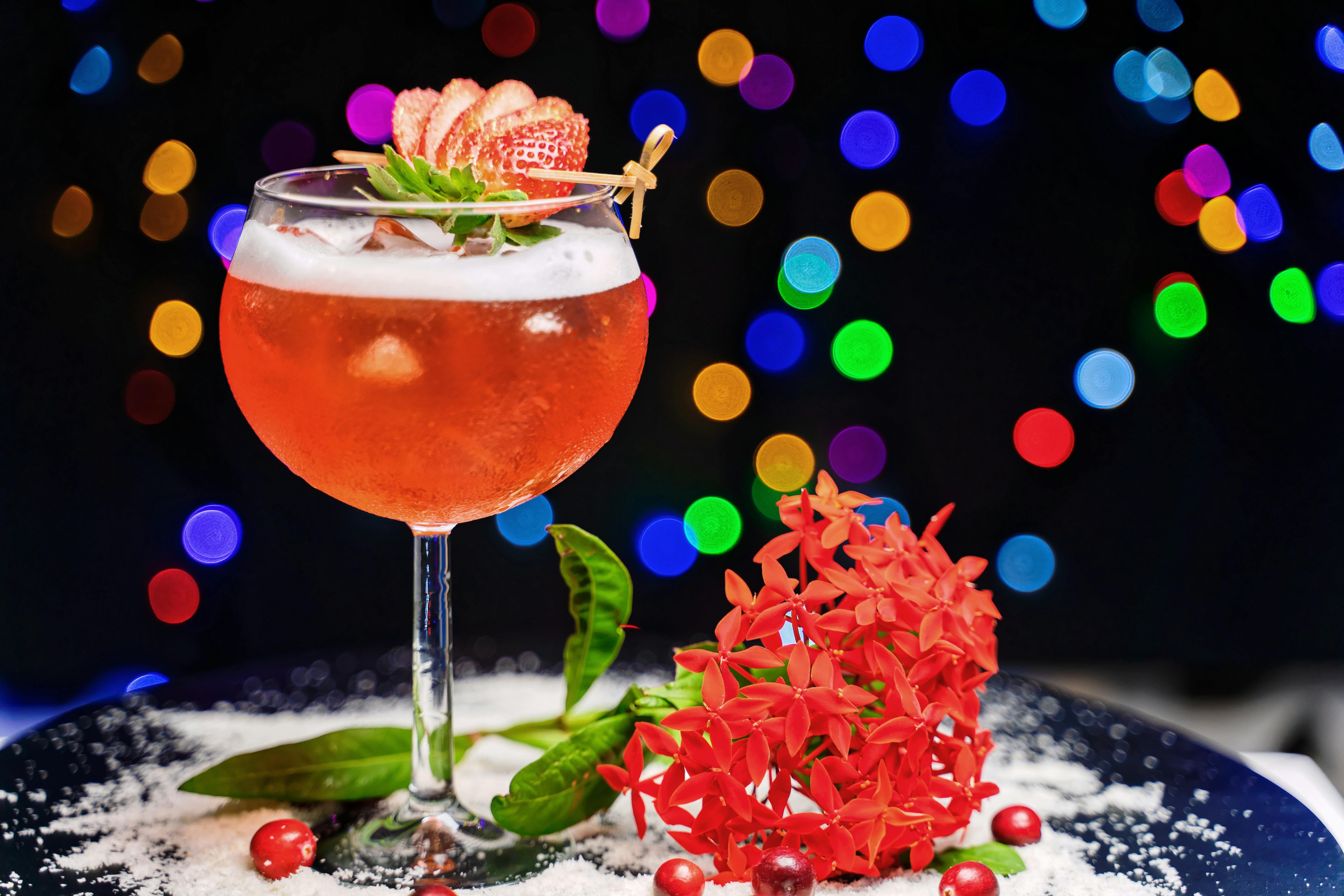 strawberry cocktail on plate decorated with red flo
