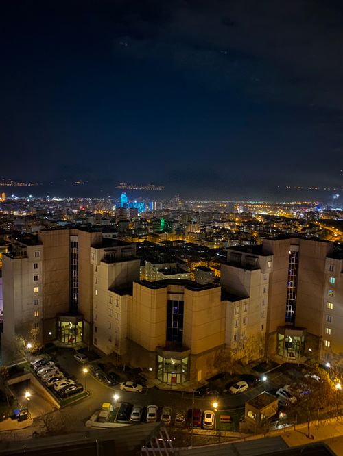 Free A breathtaking aerial view of a vibrant cityscape at night with illuminated buildings and skyline. Stock Photo