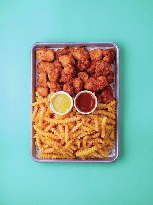 Overhead Shot of a Tray with Fries and Chicken