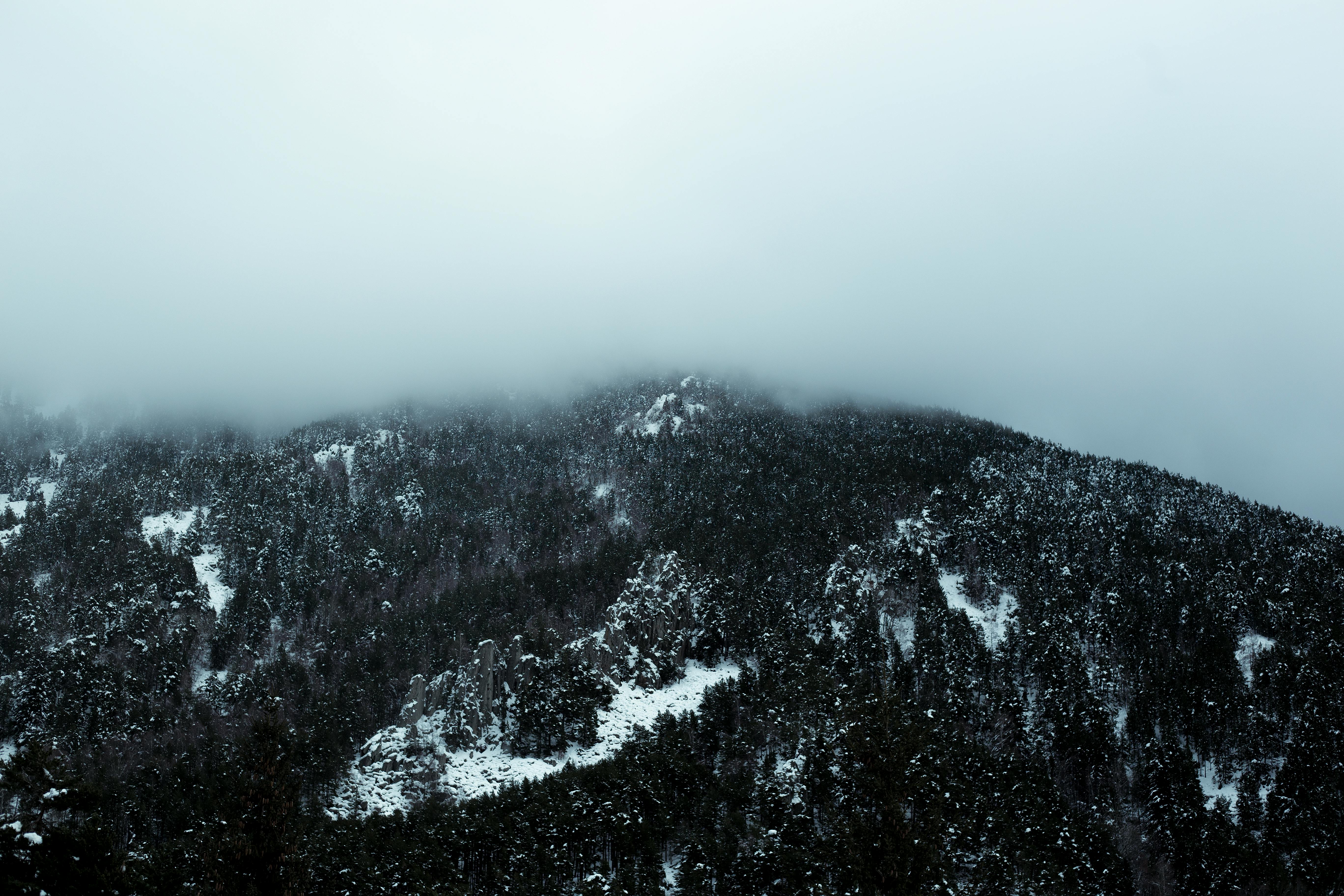 Black and White Mountain Under White Sky · Free Stock Photo