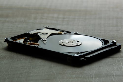 Computer Hard Drive Laid on Gray surface