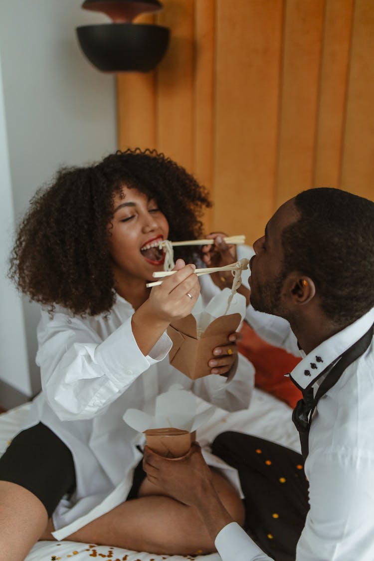 A Couple Feeding Each Other