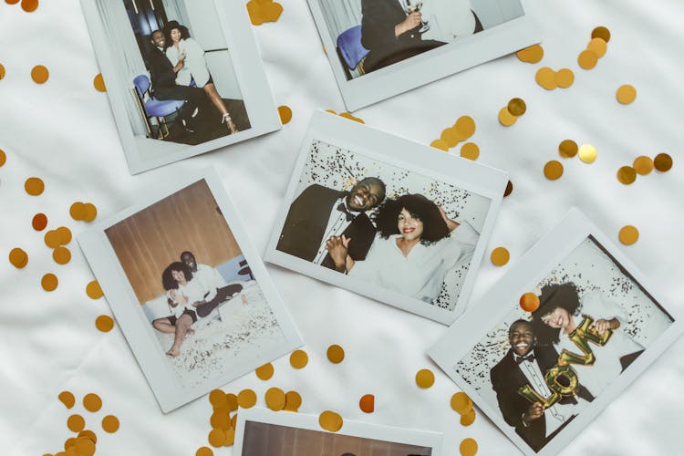 Polaroid Pictures On White Surface