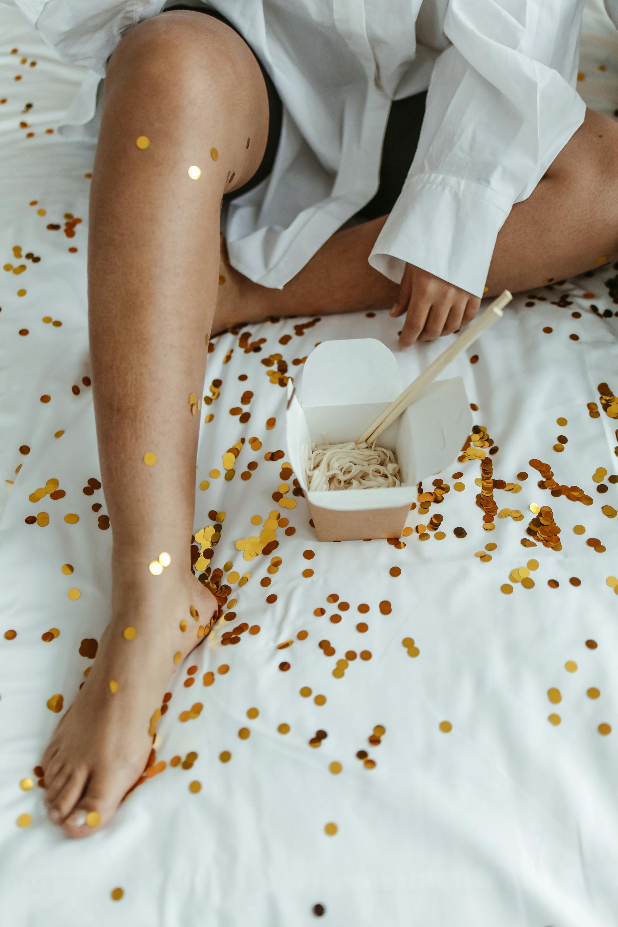 Photograph of a Black Bra Near a Takeout Box · Free Stock Photo