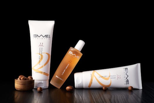 Elegant hair care set with argan oil products on a wooden surface.