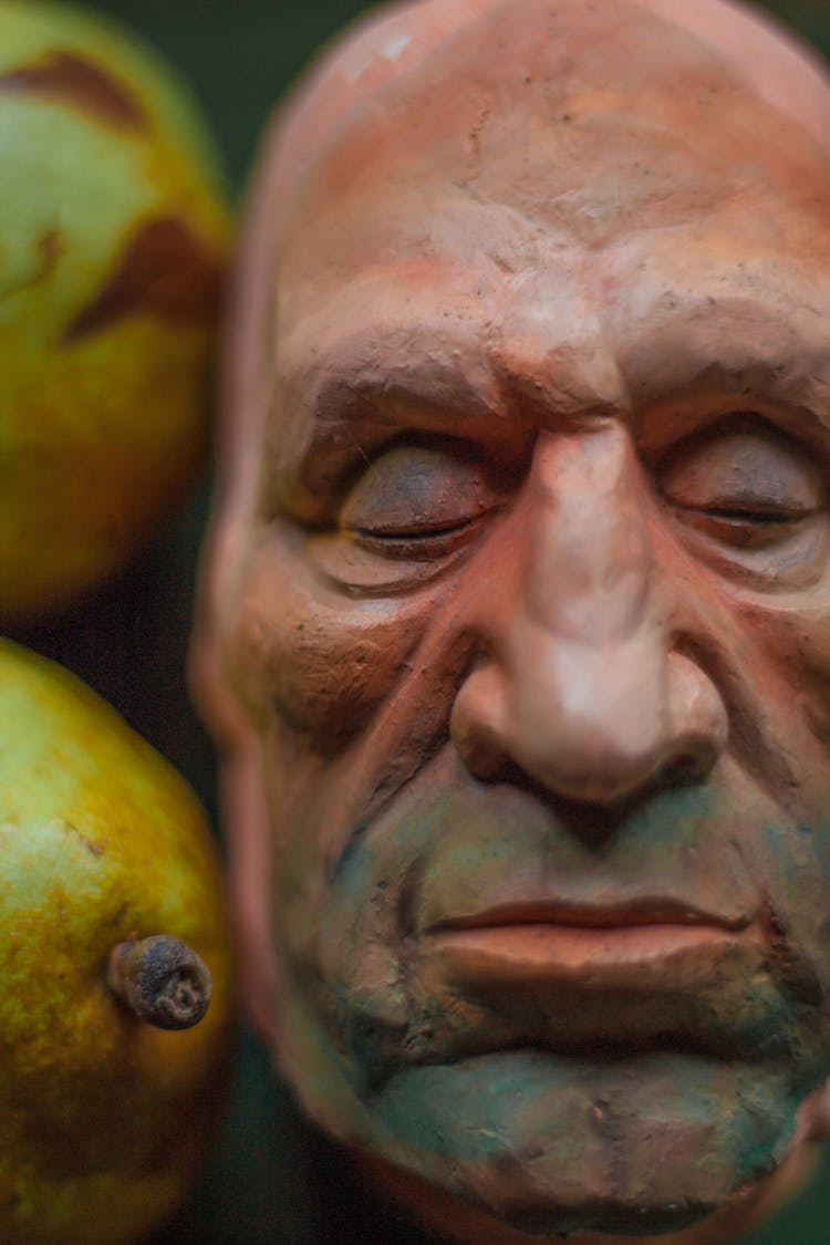 Close-up Of Clay Man Face Mask