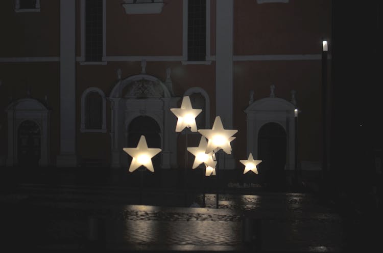 Star Shaped Decoration On Street Of Aged City In Evening