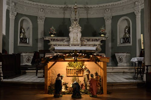 Interior of aged church with columns bas reliefs and sculptures depicting biblical scenes