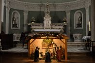 Interior of aged church with columns bas reliefs and sculptures depicting biblical scenes