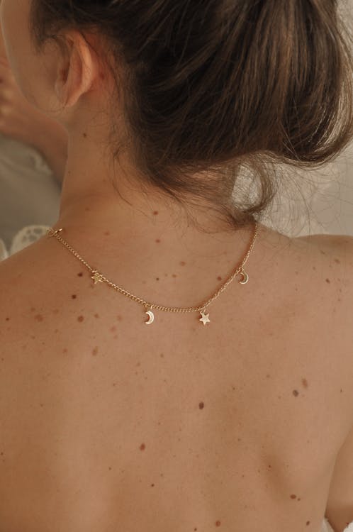 Free Woman with elegant necklace on back Stock Photo