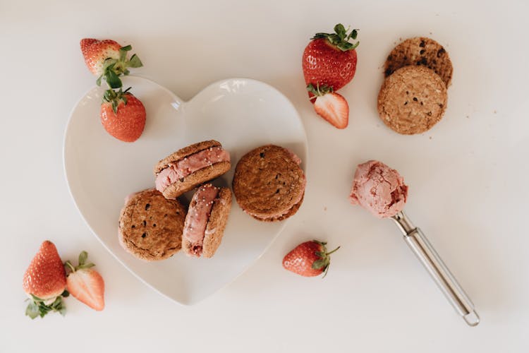 Strawberry Cookie Sandwich On Ceramic Saucer