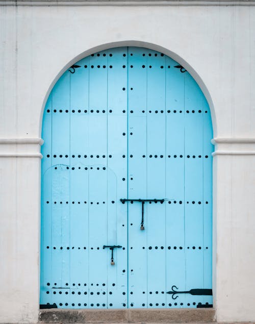 Free Blue Metal Door With White Wooden Frame Stock Photo