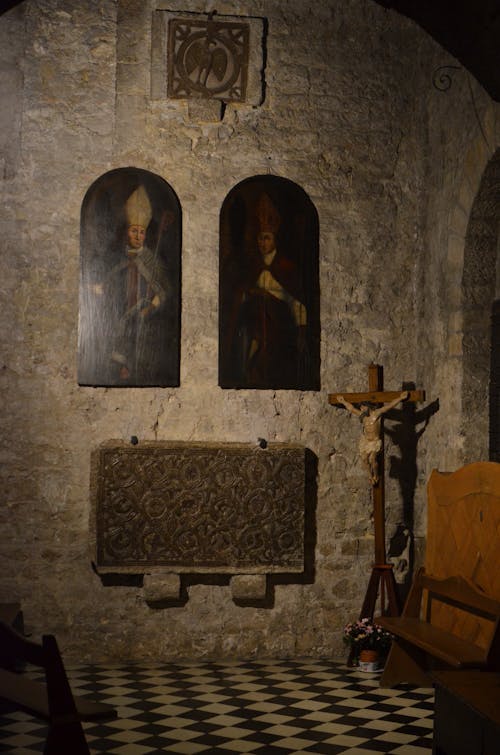 Free Icons and crucifix in old stone church Stock Photo