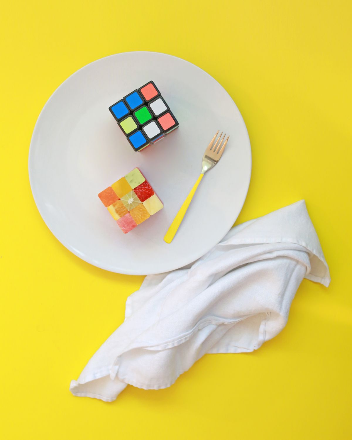 colorful 3x3 cube in a playful still-life composition