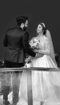 A touching black and white photo capturing a bride and groom sharing a moment on their wedding day.