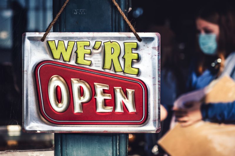 Open sign in a storefront door