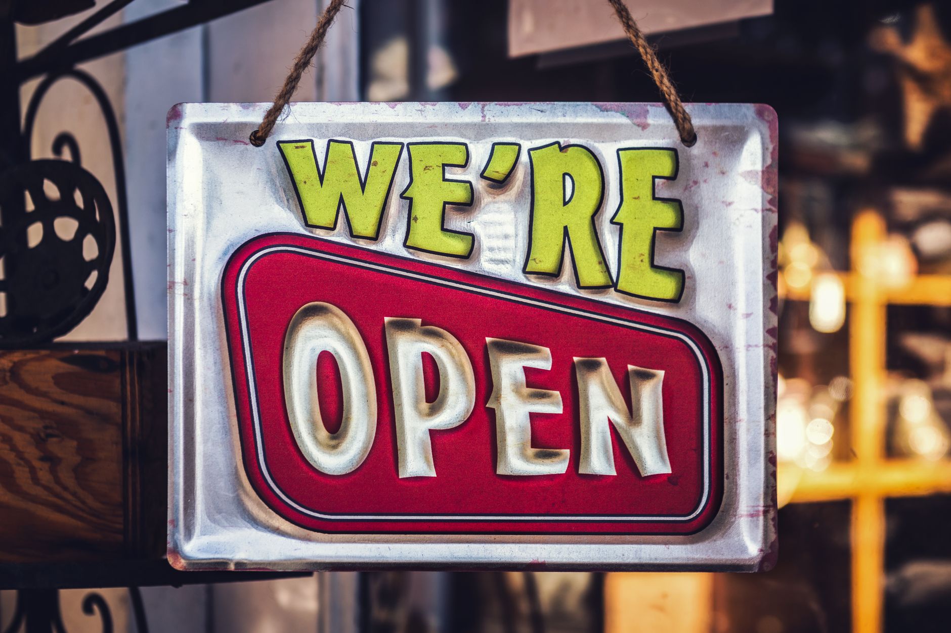 Closed sign hanging in the window of a Springfield storefront on a Sunday afternoon