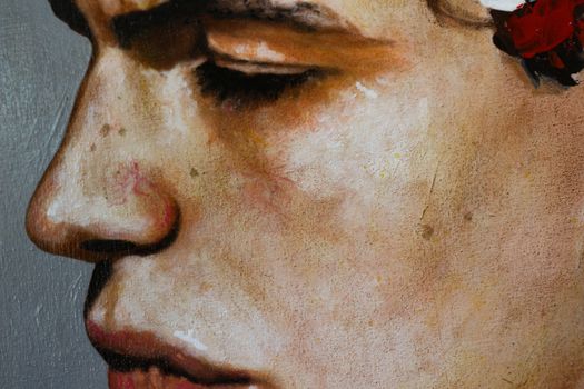 Detailed close-up of a painted portrait capturing textured brushwork and subtle color shifts.