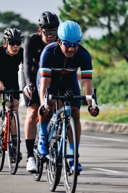 Men Riding a Road Bike