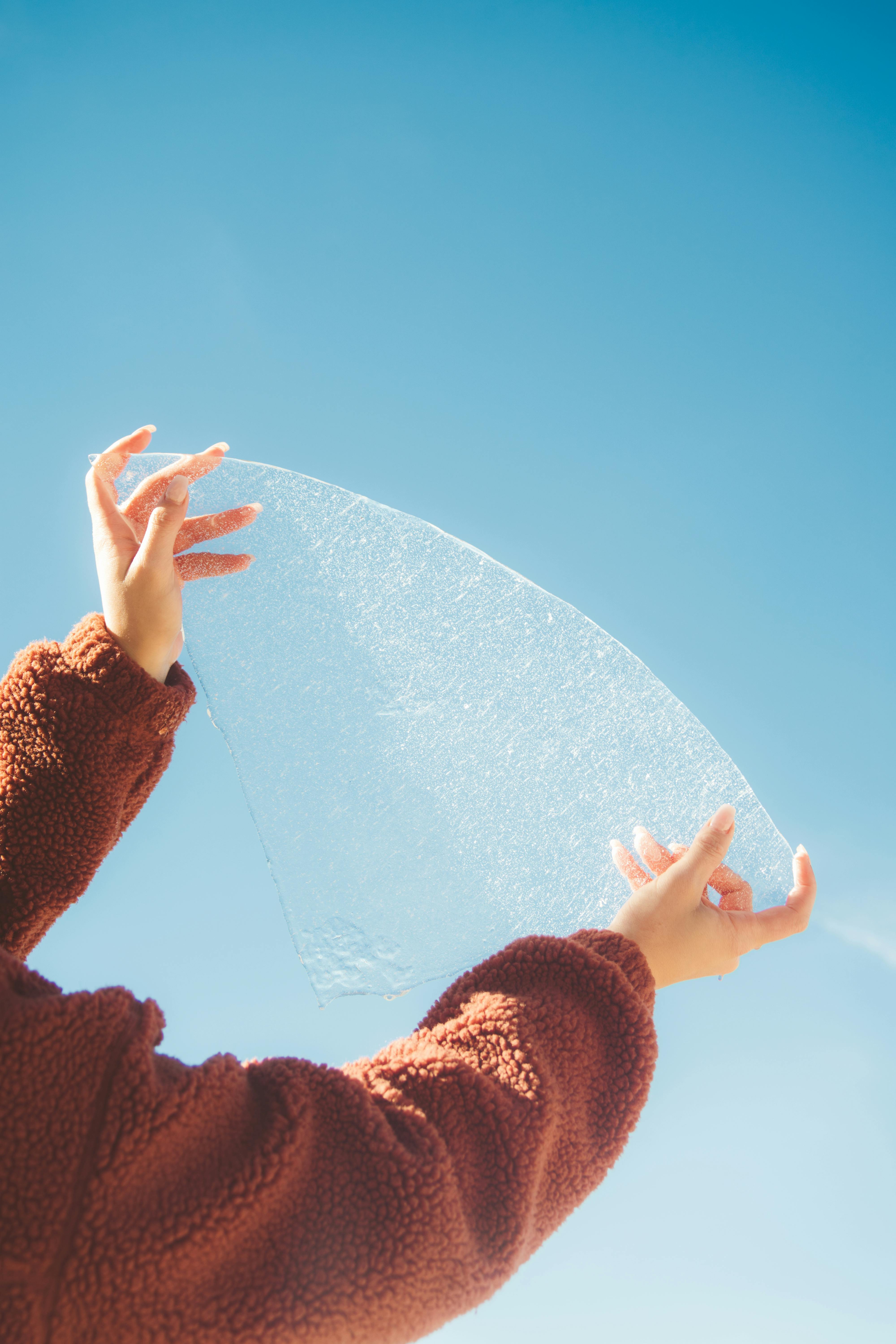 crop woman with piece of ice