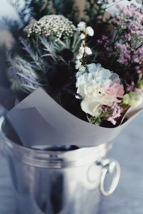 Close-Up Shot of Bouquet of Flowers in a Bucket