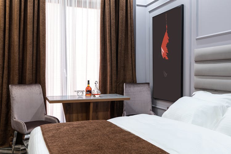 Bedroom Interior With Alcoholic Drink On Table