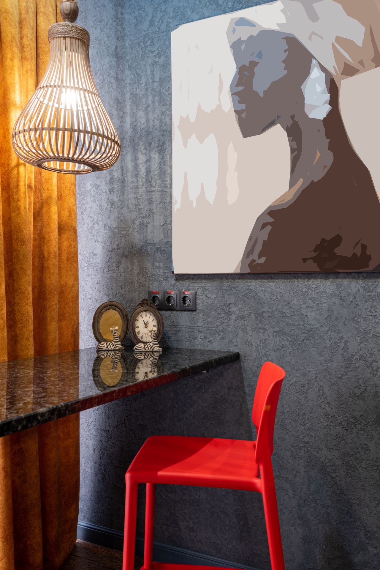 Living room wall with a large painting of an African woman in profile, a woven rattan pendant lamp and mustard curtains