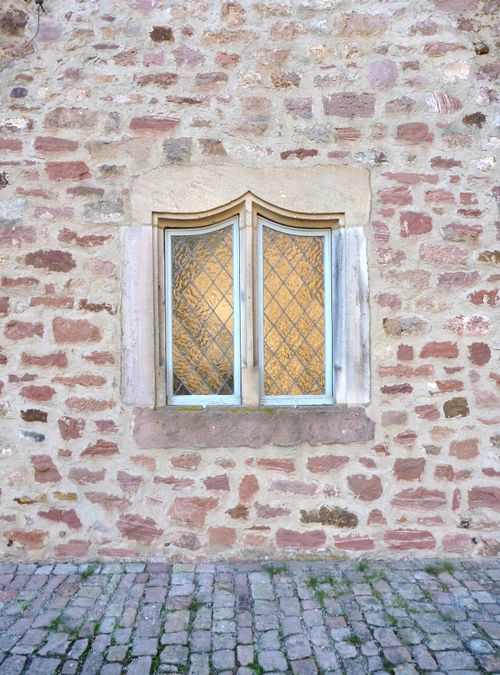 Free Vintage window set in a rustic stone wall in Steinau an der Straße, Germany. Stock Photo